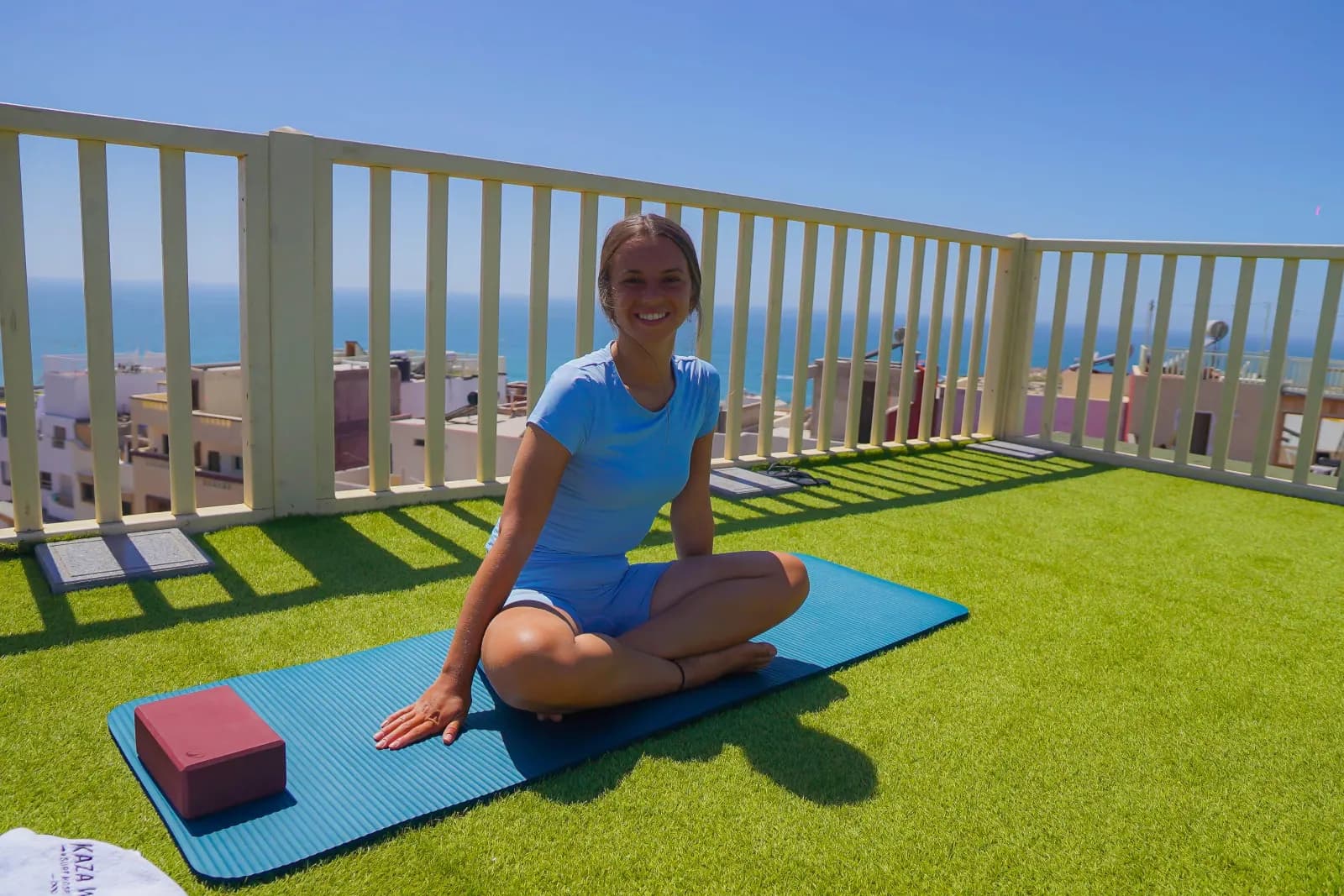 Yoga session on rooftop at KAZA Wave