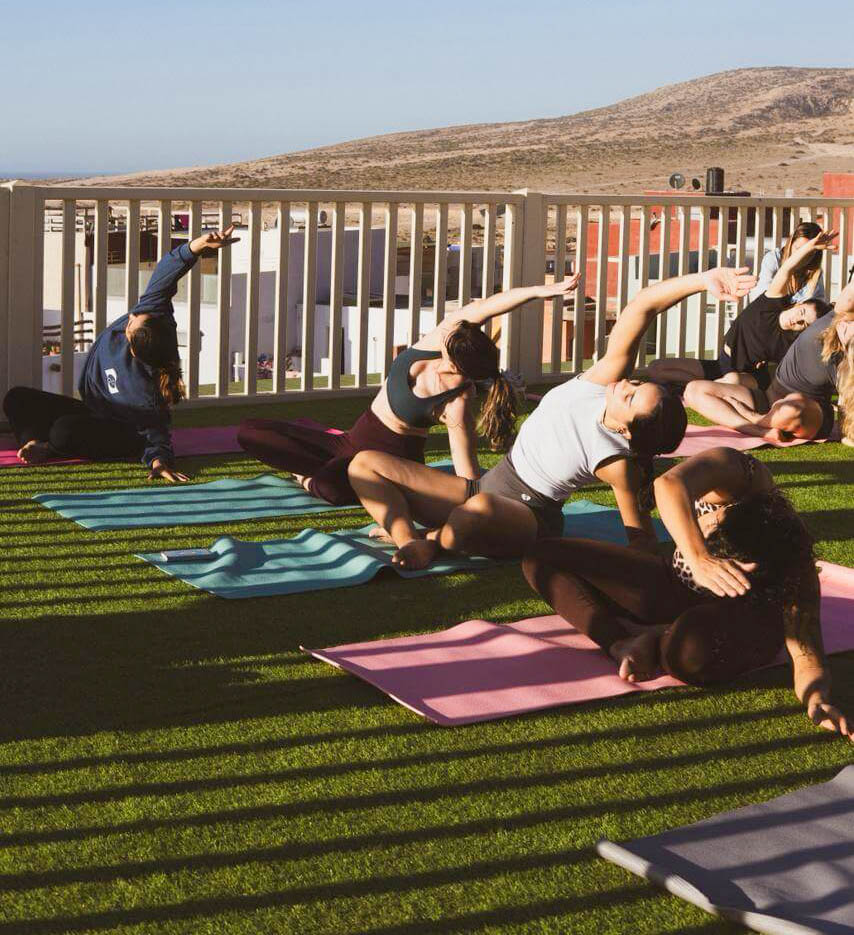 Breathwork for surfers session at KAZA Wave camp — guided practice on the rooftop